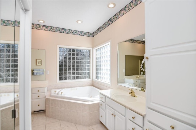 full bath with vanity, a garden tub, recessed lighting, and tile patterned floors