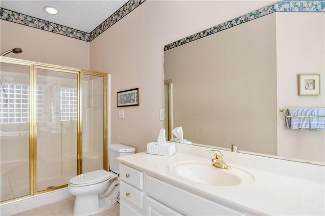 full bath with vanity, tile patterned floors, toilet, and a stall shower