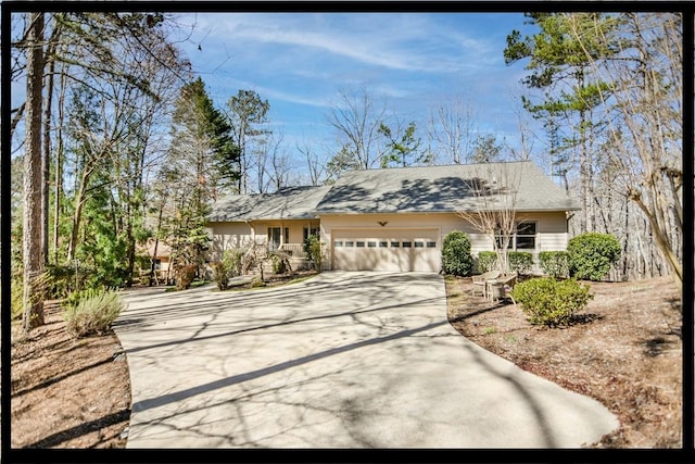 view of front of house with driveway and a garage