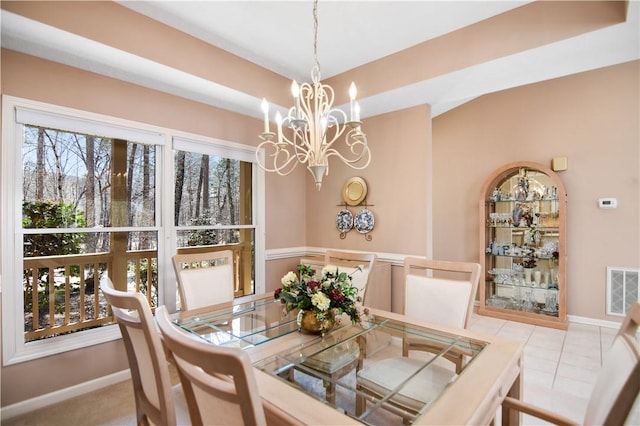 dining area with visible vents, baseboards, and an inviting chandelier