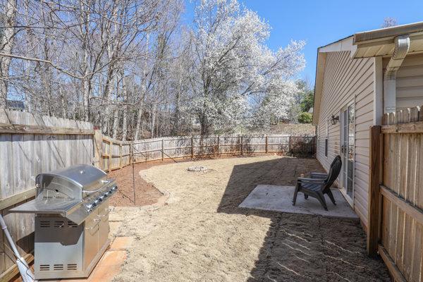 view of yard with a patio area and a fenced backyard