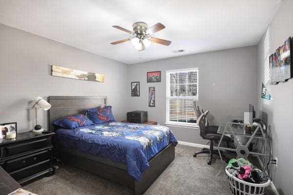 carpeted bedroom featuring a ceiling fan and baseboards