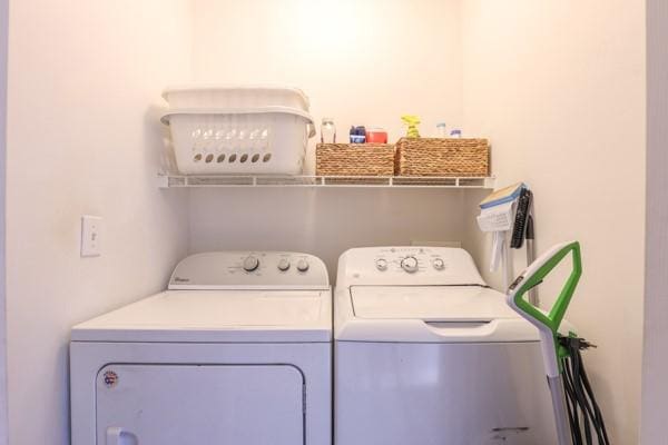 washroom with laundry area and washing machine and clothes dryer