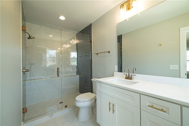 full bathroom featuring a marble finish shower, recessed lighting, toilet, and vanity