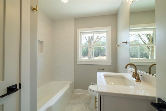 bathroom featuring marble finish floor, toilet, vanity, and baseboards