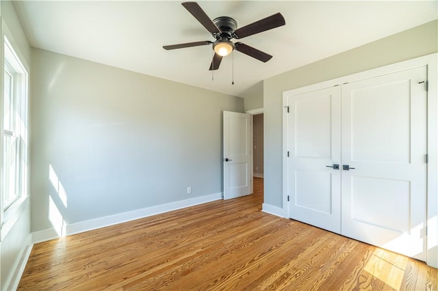 127 Old Shirley Rd, Central, SC 29630 - unfurnished bedroom with light wood finished floors, a closet, and multiple windows