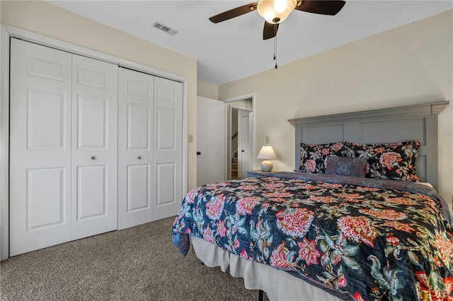 carpeted bedroom with visible vents, a closet, and ceiling fan