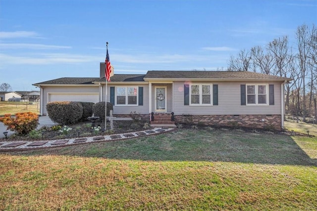 ranch-style home featuring a front lawn and an attached garage