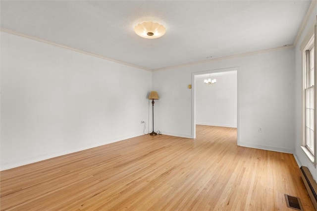 unfurnished room featuring a notable chandelier, visible vents, light wood-style flooring, and ornamental molding