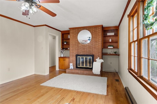 unfurnished living room featuring built in features, wood finished floors, visible vents, and a baseboard radiator