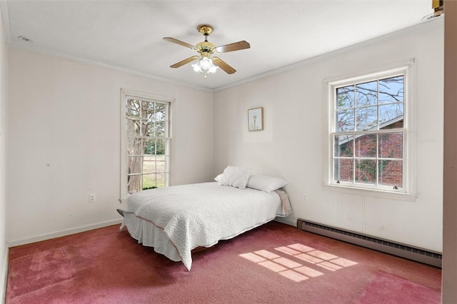 bedroom with a baseboard heating unit, multiple windows, and crown molding