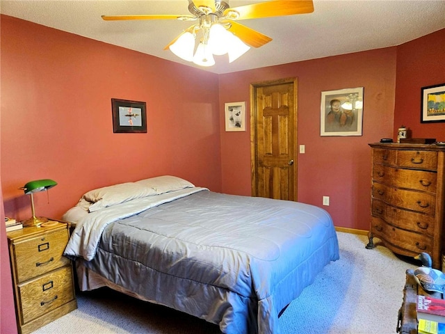 bedroom with baseboards, carpet floors, and ceiling fan