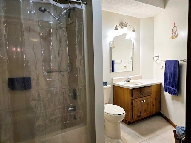 bathroom featuring toilet, curtained shower, a textured ceiling, tile patterned flooring, and vanity