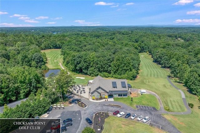 bird's eye view with a wooded view and a water view