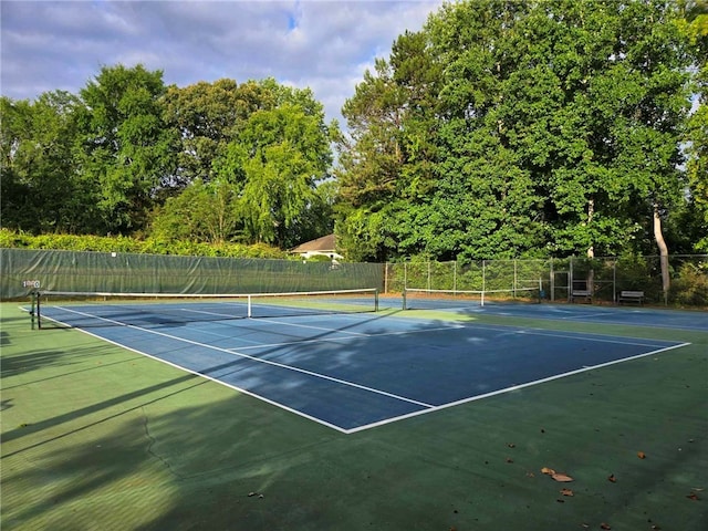 view of sport court with fence