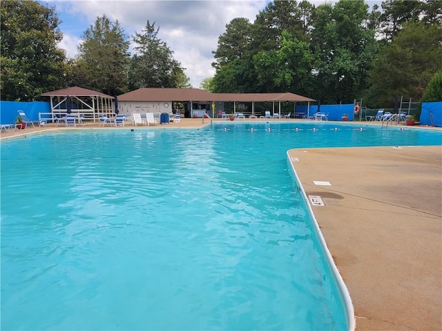 pool featuring a patio area, a gazebo, and fence