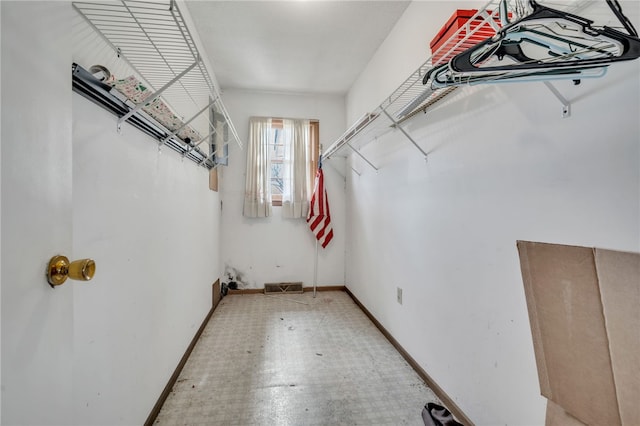 walk in closet featuring tile patterned floors and visible vents