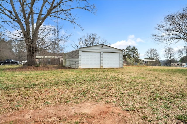 view of yard with an outbuilding and a garage