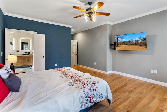 bedroom with baseboards, wood finished floors, and ornamental molding