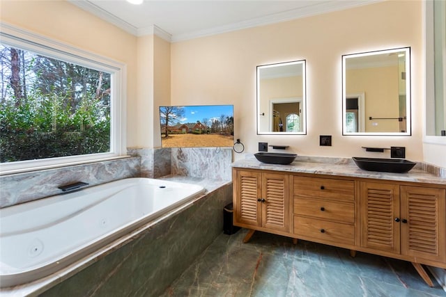 full bathroom with crown molding, double vanity, a whirlpool tub, and a sink