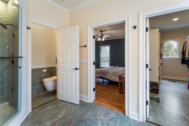 ensuite bathroom with a shower stall, ensuite bath, crown molding, and a ceiling fan