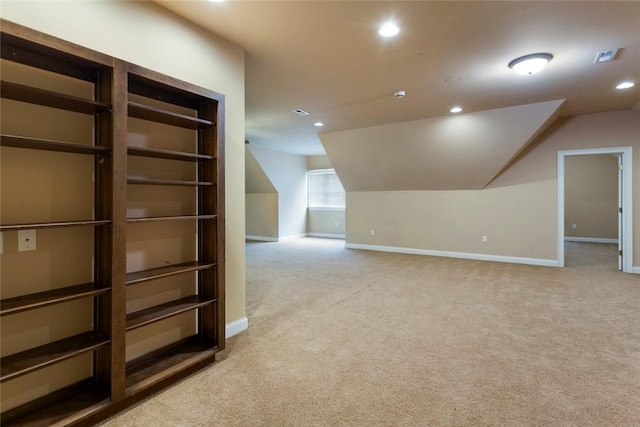 additional living space featuring recessed lighting, baseboards, light carpet, and vaulted ceiling