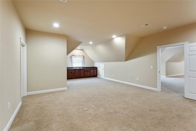 bonus room with recessed lighting, baseboards, and light carpet