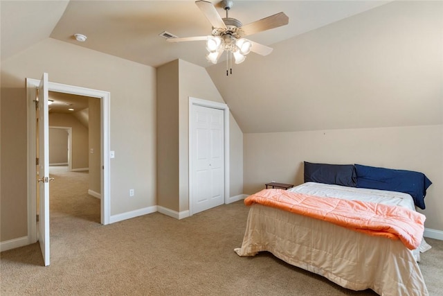 carpeted bedroom featuring visible vents, lofted ceiling, baseboards, and ceiling fan