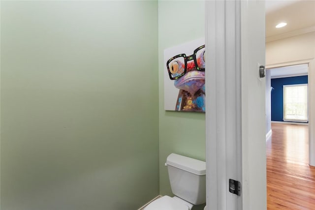 bathroom featuring recessed lighting, baseboards, toilet, and wood finished floors