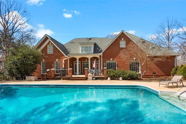 pool featuring french doors and a patio area