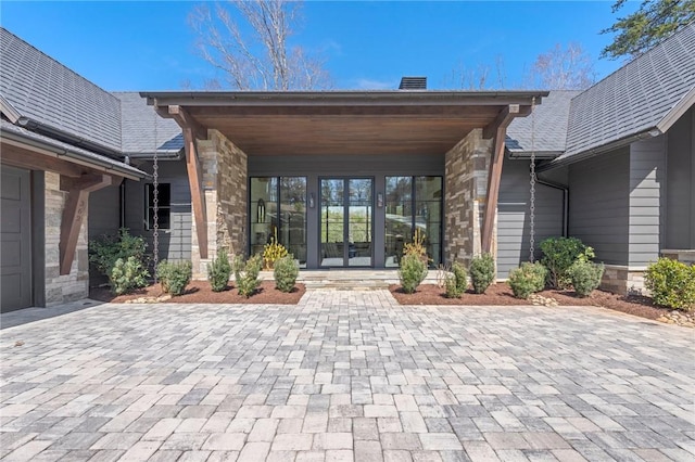 entrance to property with stone siding