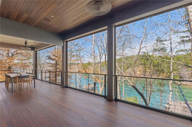 unfurnished sunroom with wood ceiling