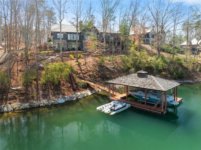 view of dock with a water view and boat lift