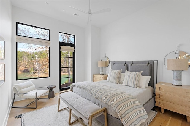 bedroom with visible vents and wood finished floors