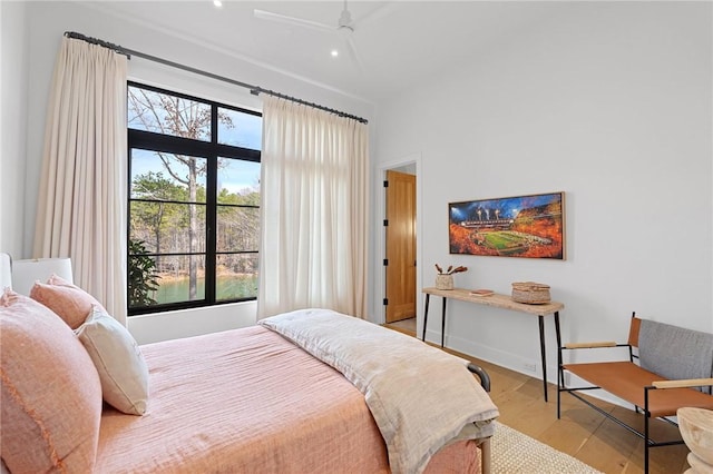 bedroom featuring multiple windows, wood finished floors, recessed lighting, and ceiling fan