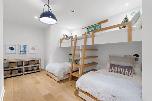 bedroom featuring visible vents, recessed lighting, and wood finished floors