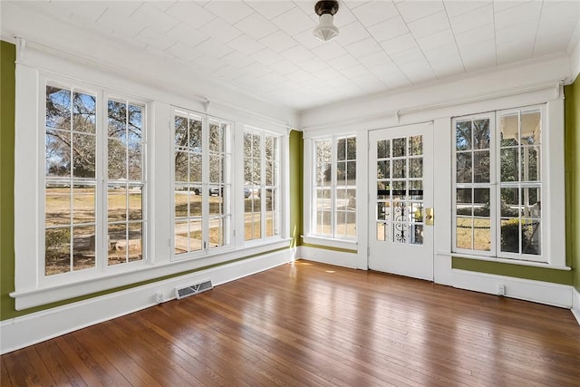 unfurnished sunroom with visible vents