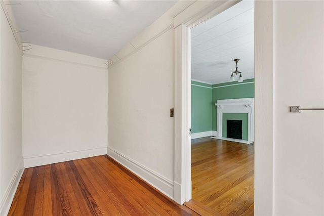 interior space featuring hardwood / wood-style floors and a fireplace with flush hearth