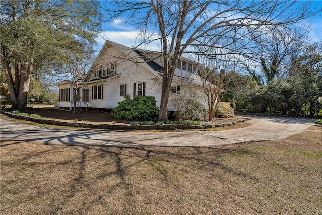 view of home's exterior featuring driveway