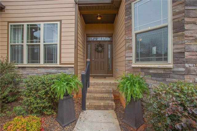 view of exterior entry with stone siding