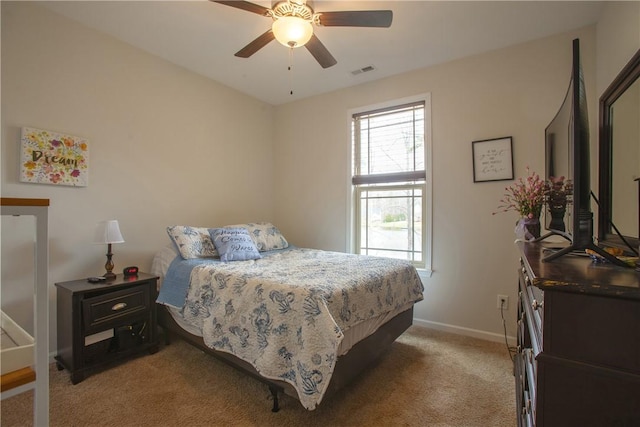 bedroom with light carpet, visible vents, ceiling fan, and baseboards