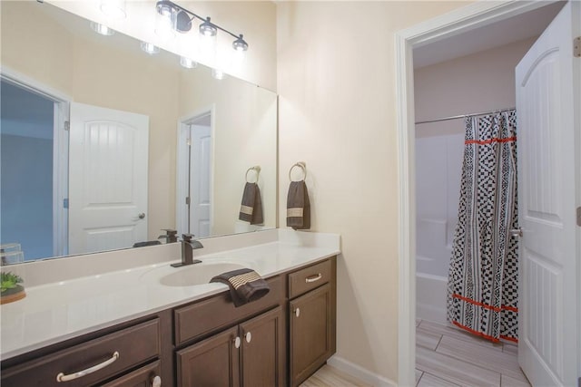 bathroom featuring vanity and a shower with shower curtain