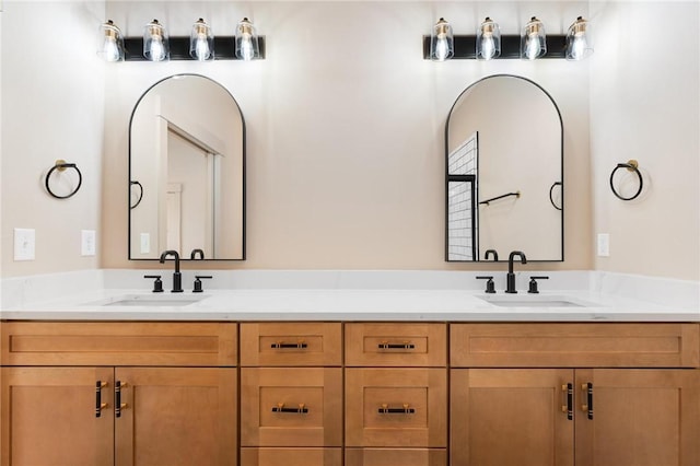 bathroom featuring double vanity and a sink