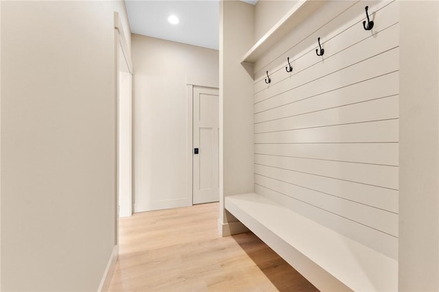 mudroom with recessed lighting, baseboards, and light wood finished floors