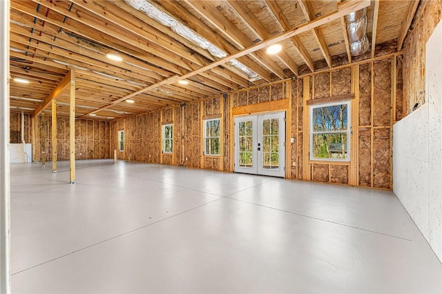 misc room featuring french doors and concrete flooring