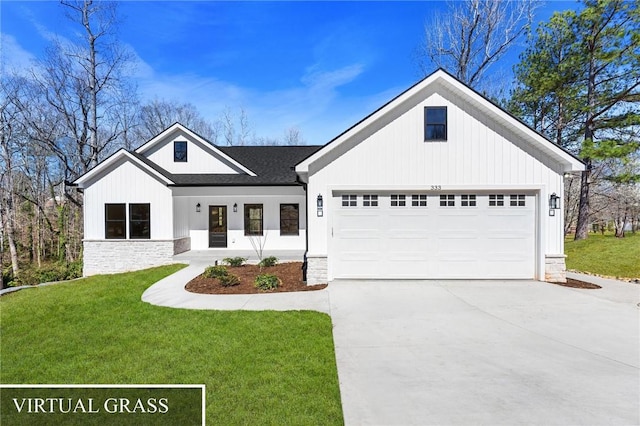 modern farmhouse featuring a front lawn, a garage, stone siding, and driveway
