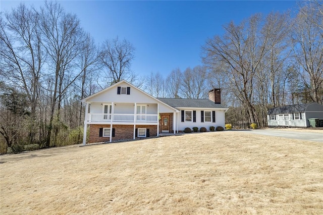 404 S Old Mill Rd, Seneca, SC 29678 - view of front of property with brick siding, a front lawn, covered porch, and a chimney