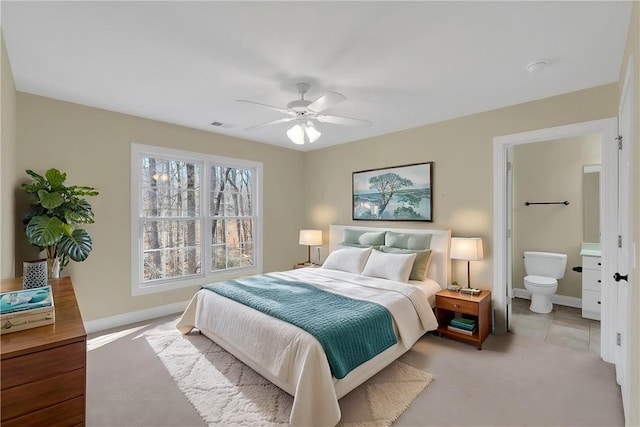 523 Heron Cove Cir, Seneca, SC 29672 - carpeted bedroom featuring baseboards, ensuite bath, and ceiling fan