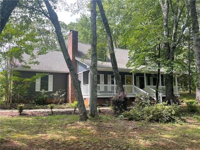 236 Issaqueena Dr, Central, SC 29630 - ranch-style house featuring covered porch, roof with shingles, and a chimney