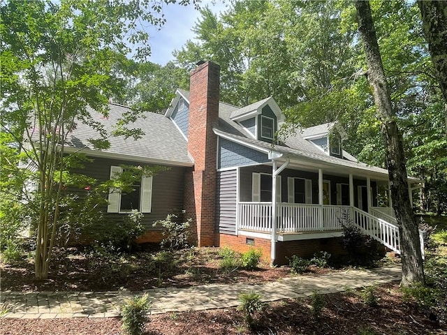 236 Issaqueena Dr, Central, SC 29630 - view of front of home featuring a porch, a shingled roof, crawl space, and a chimney